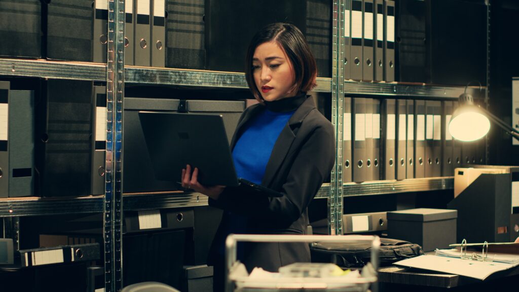 detective evaluating old archived folders organize all cases based crimes