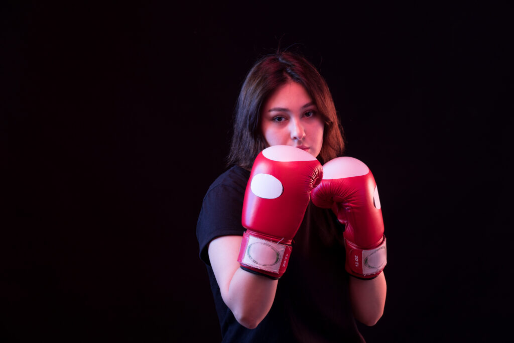 young beautiful woman black t shirt red boxing gloves 1
